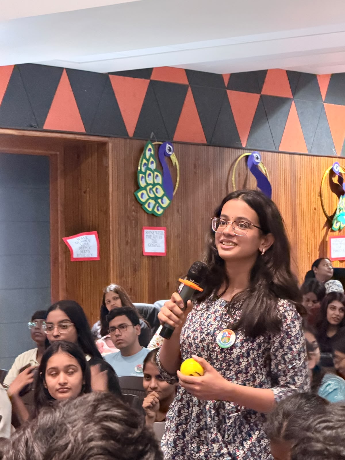 A student speaking up during a college session